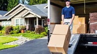 一个穿蓝色衬衫的人用手推车从一辆搬家车上卸下两个箱子